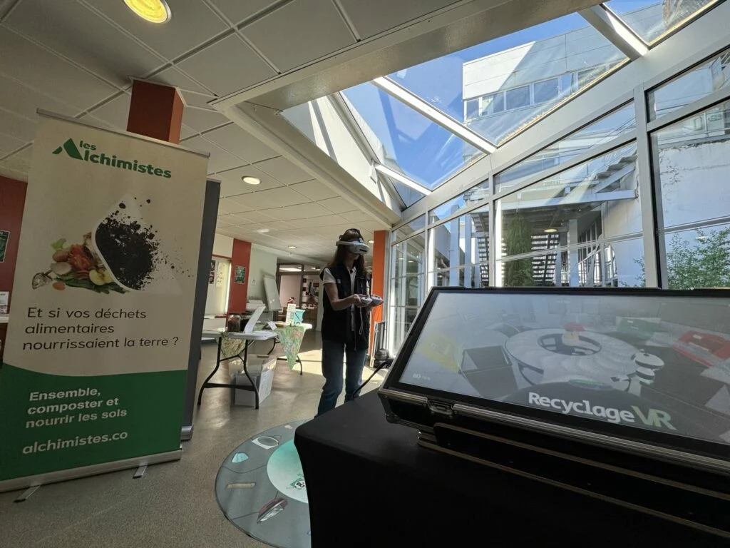 RecyclageVR station and display beside Les Alchimistes compost information.