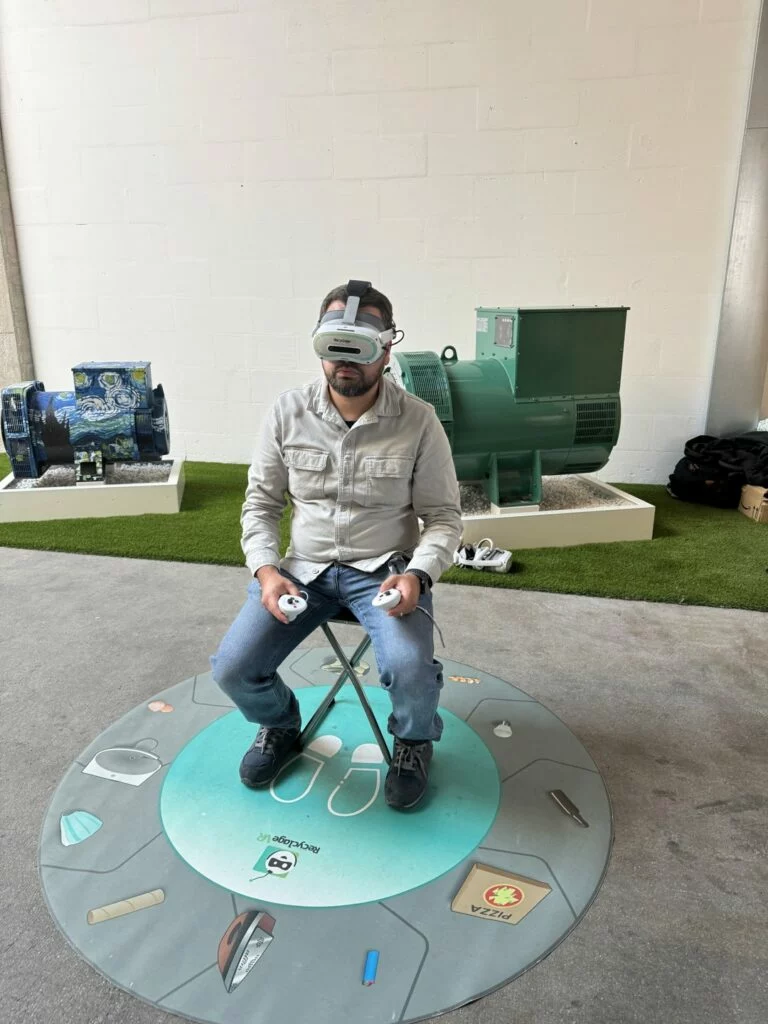 A participant explores The Compost Adventure while seated at Nidec in Angoulême.