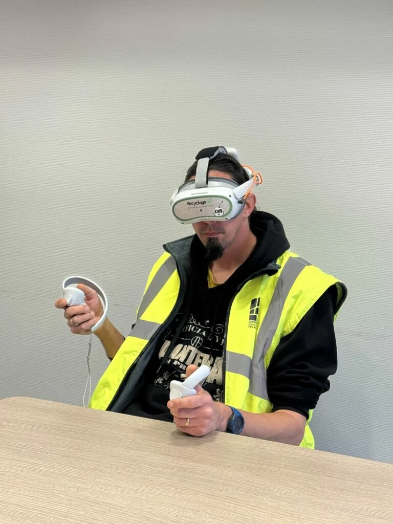 A seated CompostVR trial with a headset and controllers in Albi.